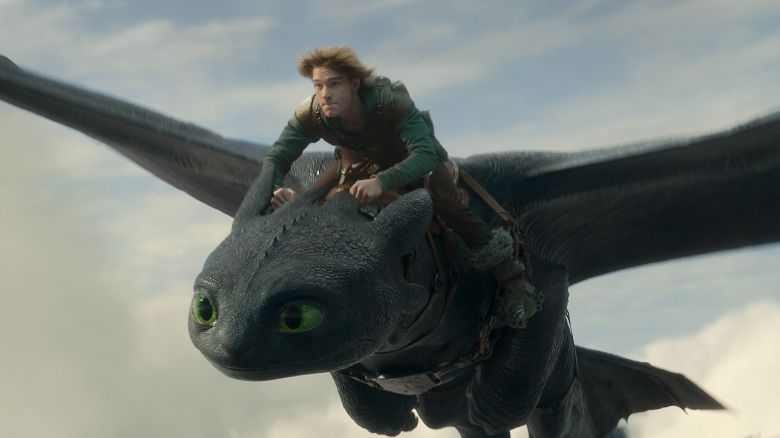 (from left) Night Fury dragon, Toothless, and Hiccup (Mason Thames) in Universal Pictures’ live-action How to Train Your Dragon, written and directed by Dean DeBlois.