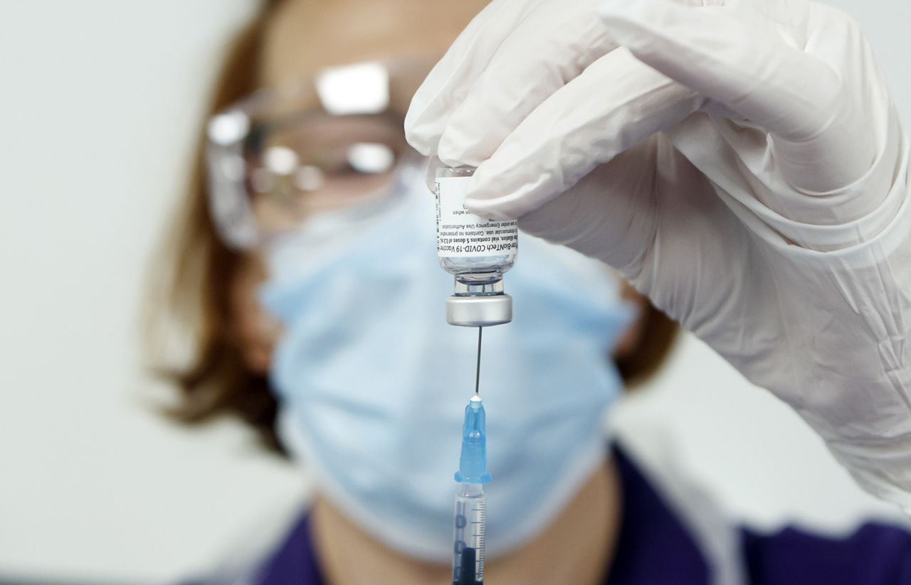 A nurse prepares the Pfizer-BioNTech vaccine at the Thackray Museum of Medicine in Leeds, England, on December 22, 2020.