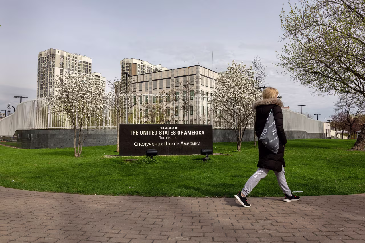 A woman walks past the United States Embassy to Ukraine on April 25 in Kyiv.