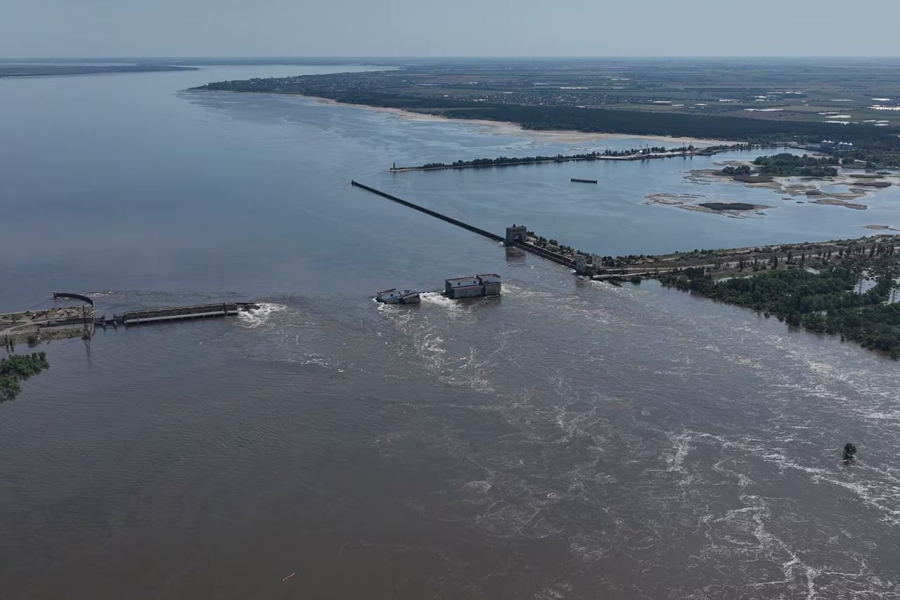 Water flows over the collapsed Nova Kakhovka dam on June 7.