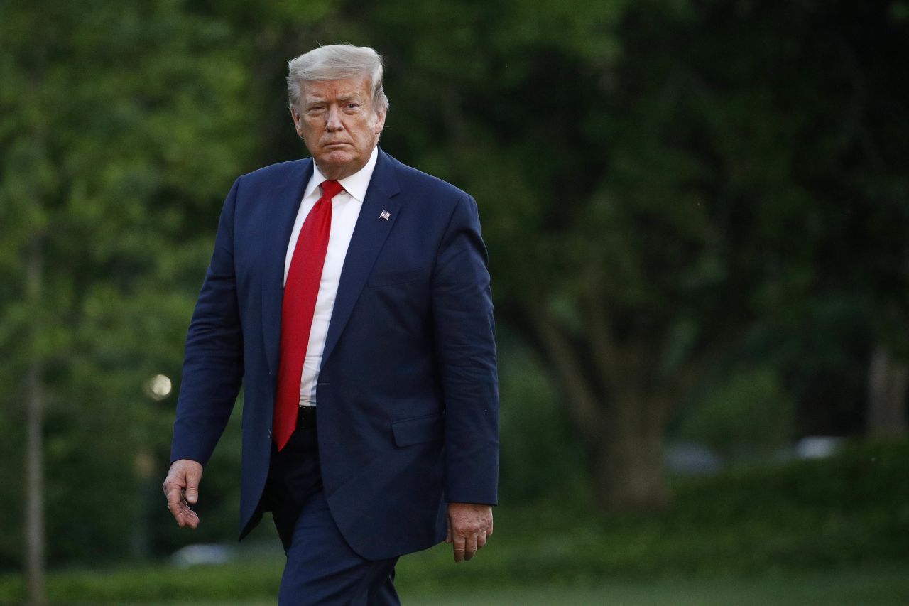 President Donald Trump walks on the South Lawn of the White House on May 30.