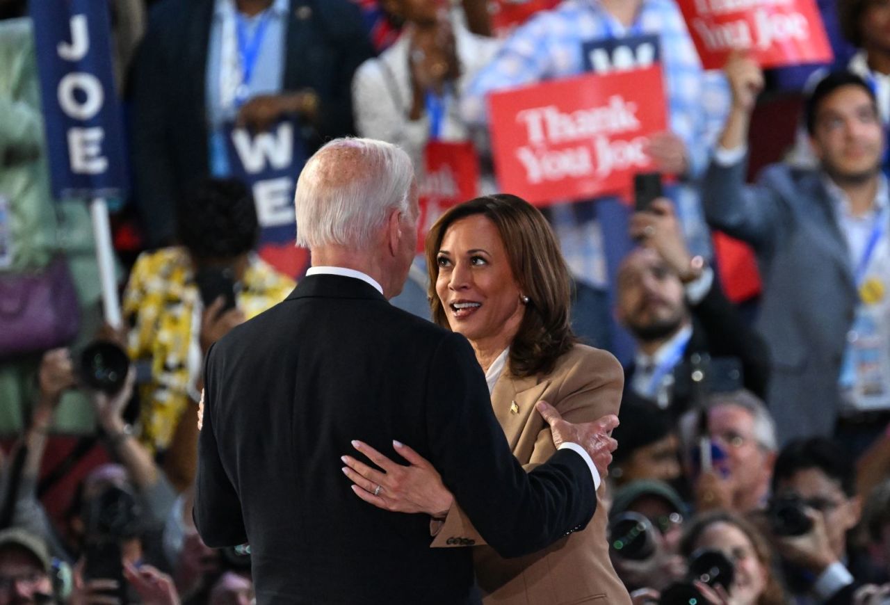 President Joe Biden and Vice President Kamala Harris embrace after his keynote address on Monday, August 19, in Chicago.