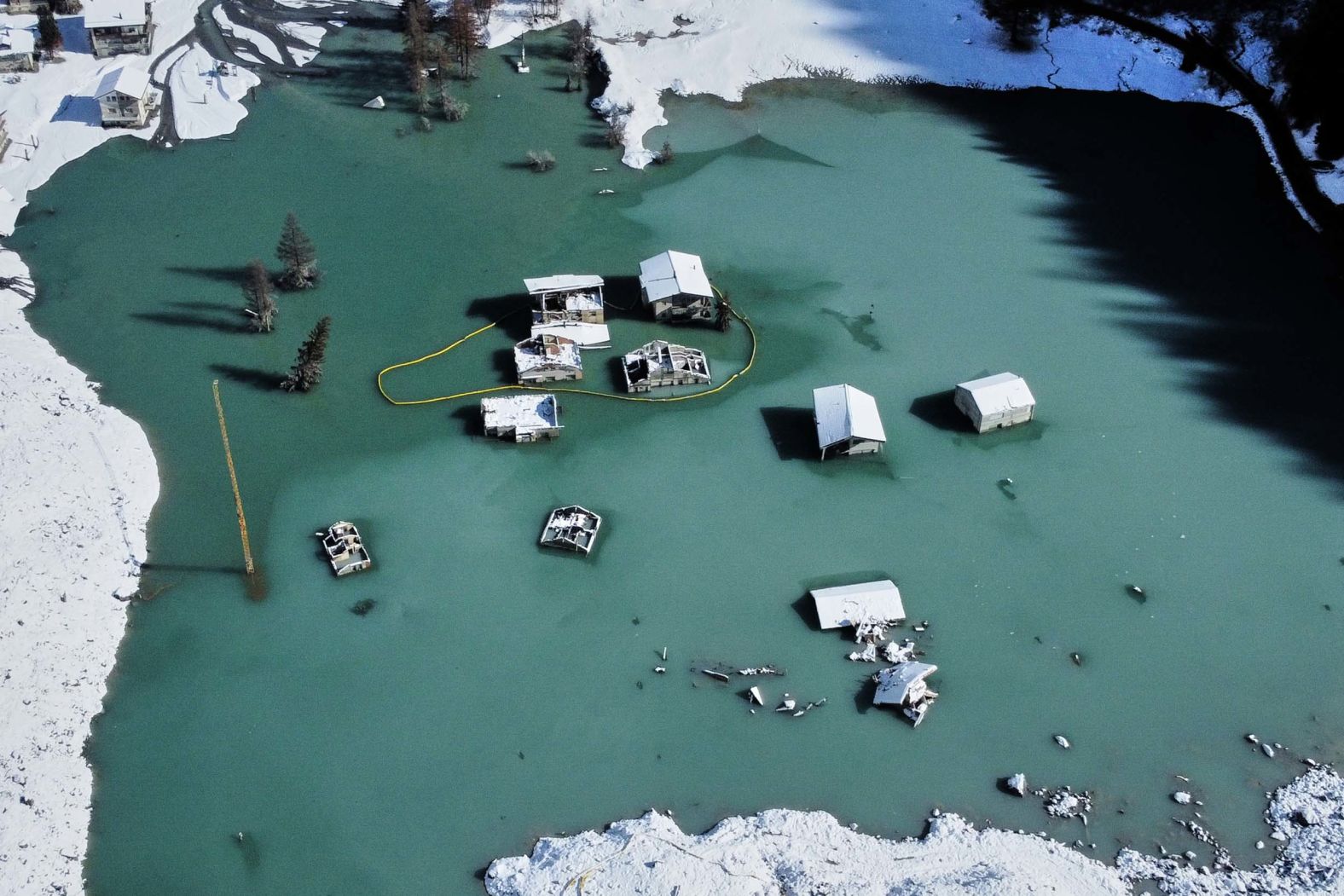 This aerial photo, taken on Tuesday, October 28, shows the partly flooded village of Blatten, Switzerland, five months after it was <a href="index.php?page=&url=https%3A%2F%2Fwww.cnn.com%2F2025%2F05%2F28%2Feurope%2Fwiss-alps-glacier-collapse-switzerland-latam-intl">buried in a landslide</a>.