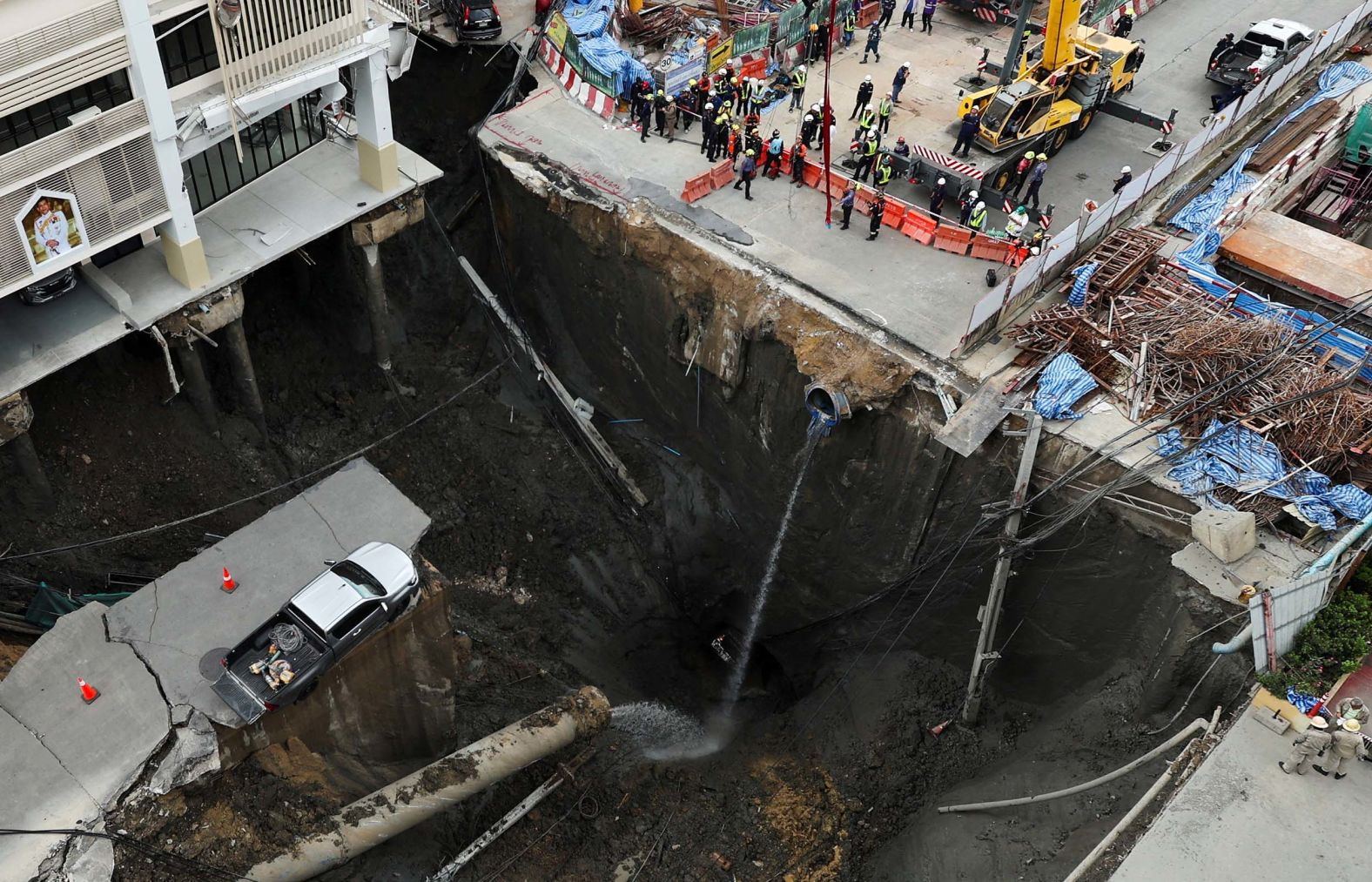 A vehicle teeters on the edge of a <a href="index.php?page=&url=https%3A%2F%2Fwww.cnn.com%2F2025%2F09%2F24%2Fworld%2Fvideo%2Fbangkok-thailand-sinkhole-vrtc-ldn-digvid">massive sinkhole</a> that opened in Bangkok, Thailand, on Wednesday, September 24. Thailand’s prime minister said it was caused by works on an underground train line. No injuries were reported, according to the Reuters news agency.