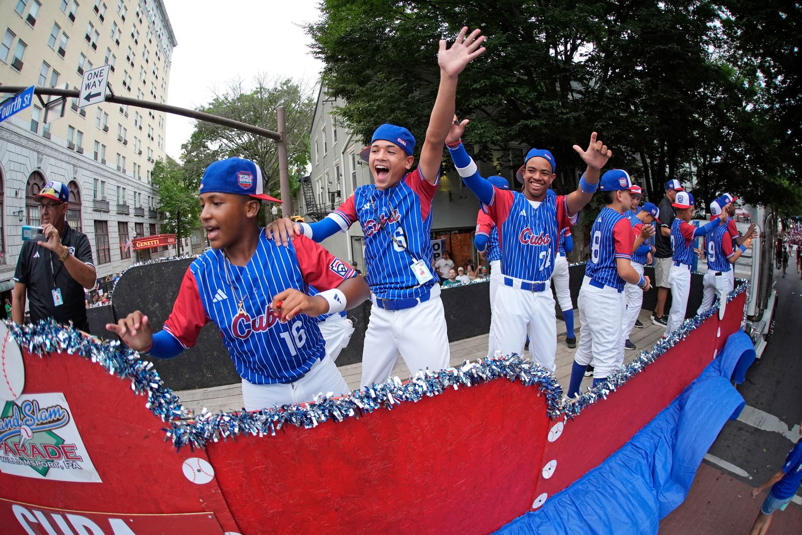 Little League baseball players from Villa Clara, Cuba, take part in the Little League Grand Slam Parade in Williamsport, Pennsylvania, on Tuesday, August 13.