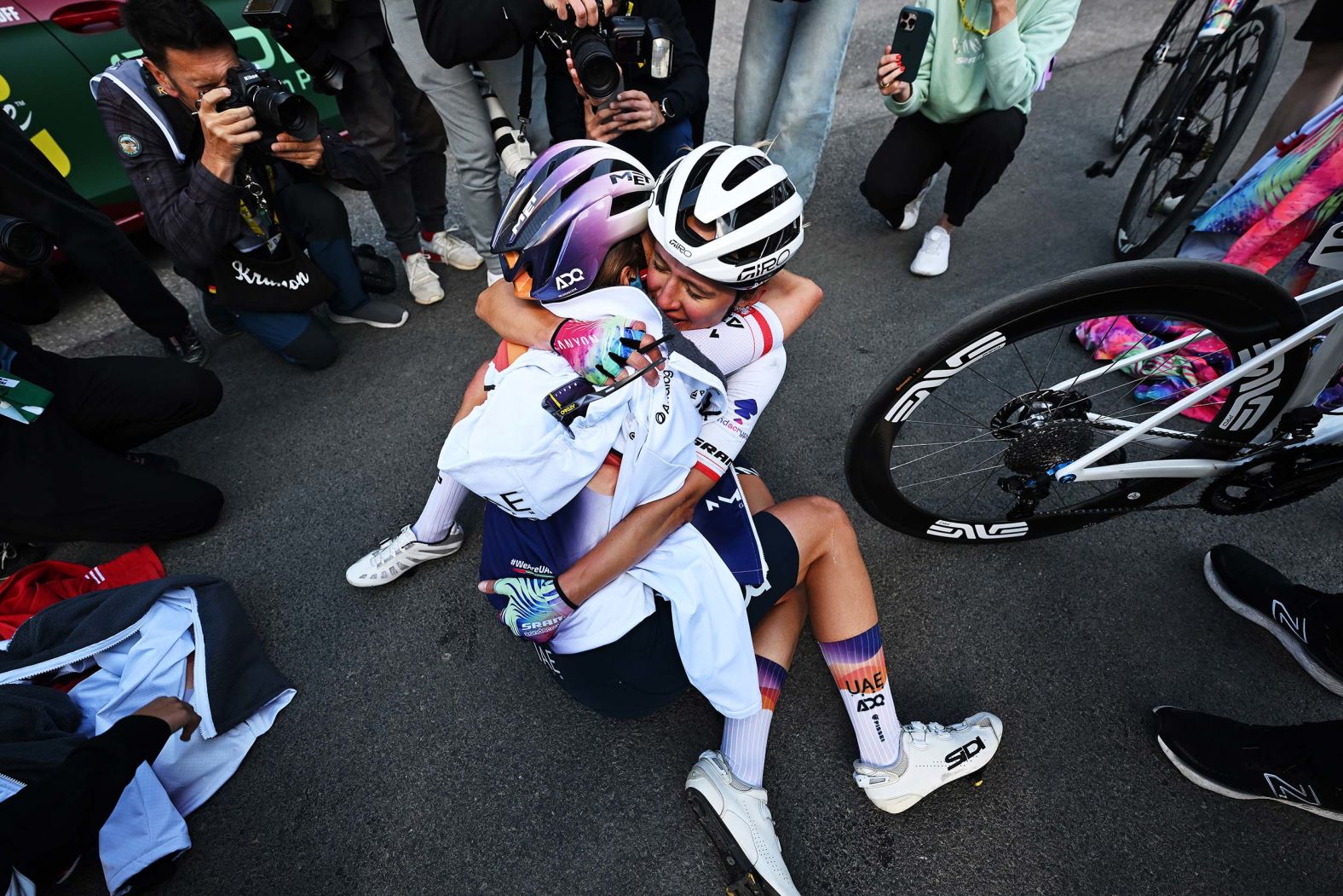 From left, Dominika Wlodarczyk and Katarzyna Niewiadoma congratulate each other after the final stage of the Tour de France Femmes in Châtel, France, on Sunday, August 3. Niewiadoma placed third overall in the race.