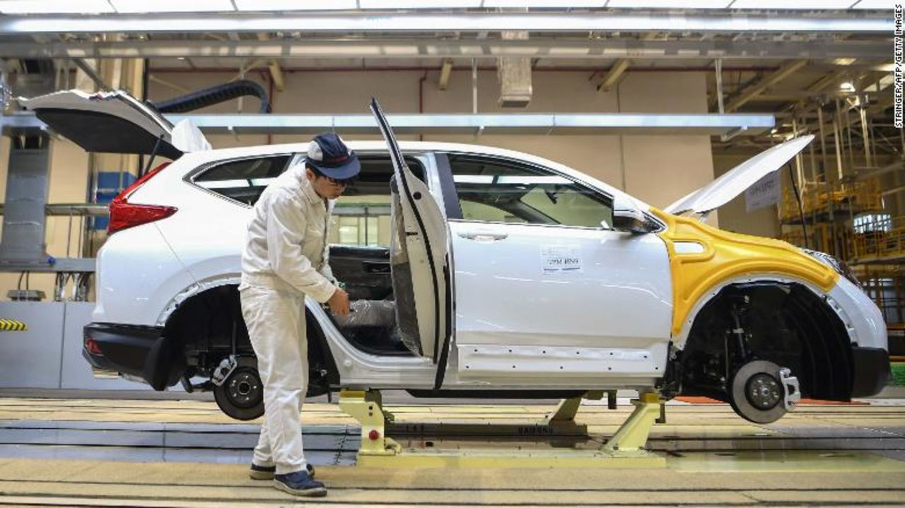 An employee works on an assembly line at Dongfeng Honda in Wuhan.