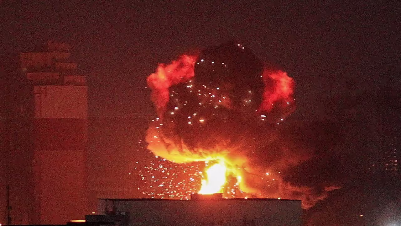 An explosion is seen in the sky over Kyiv, Ukraine, during a Russian missile strike on Wednesday, August 30, 2023. 