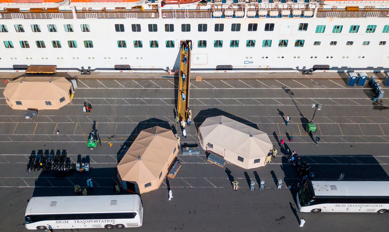 Passengers are disembarked from the Grand Princess cruise ship at the Port of Oakland in Oakland, California on March 10, 2020.?