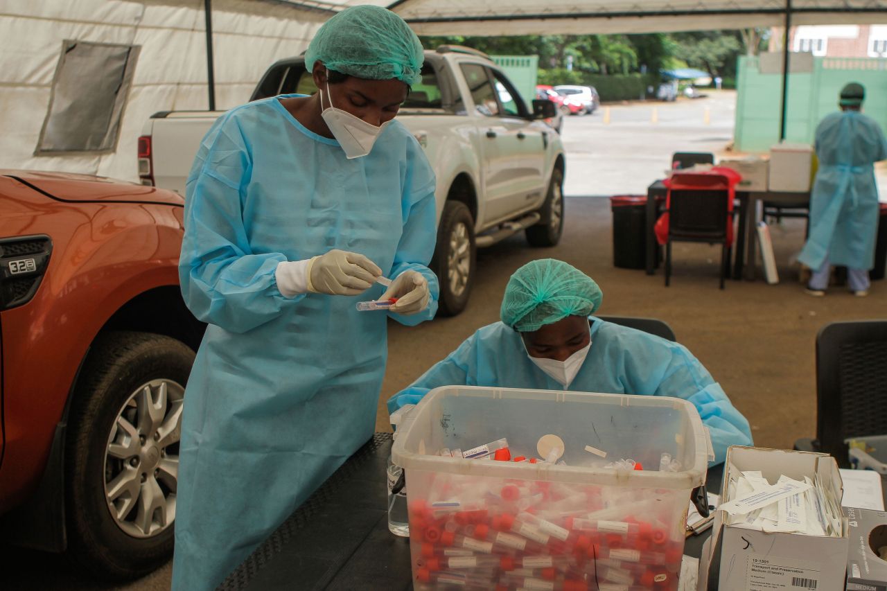 Lancet Clinical Laboratories employees in Harare, Zimbabwe, secure samples after conducting Covid-19 tests at a St Anne's Hospital drive thru facility on January 22.