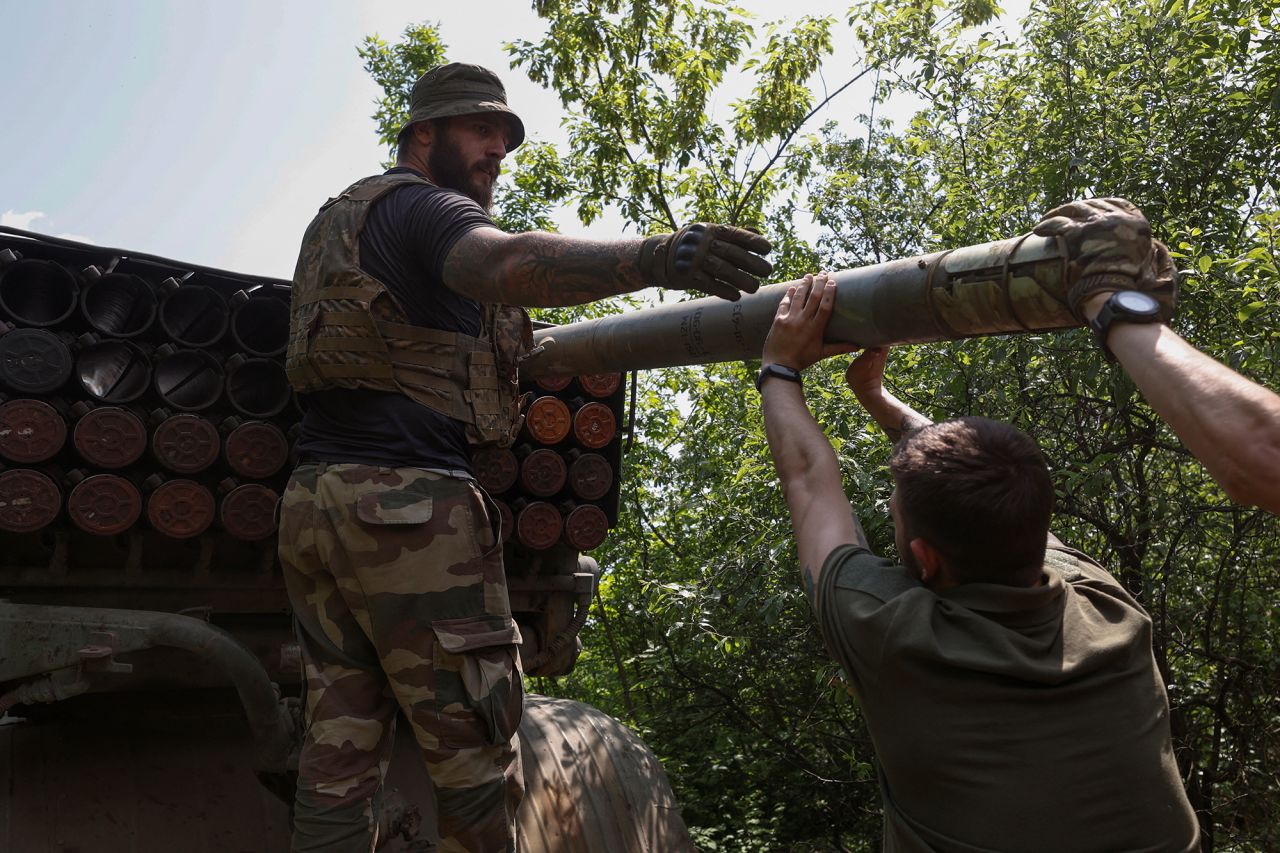 Ukrainian servicemen load a rocket near the frontline town of Bakhmut, Ukraine, on May 19. 