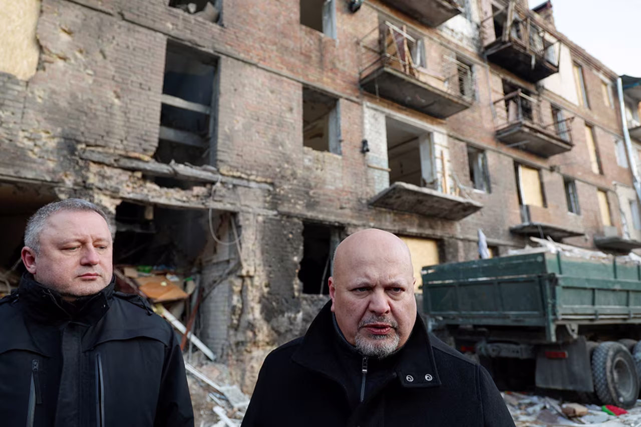 International Criminal Court Prosecutor Karim Khan and Ukrainian Prosecutor General Andriy Kostin speak to journalists on February 28, as they visit the site of a residential building damaged by a Russian missile strike late November, in the town of Vyshhorod, outside Kyiv, Ukraine.