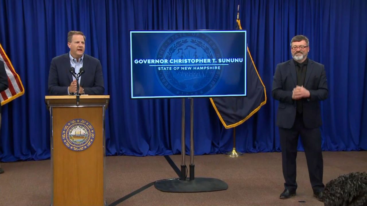 New Hampshire Gov. Chris Sununu, left, speaks during a press conference in Concord, New Hampshire, on June 10.