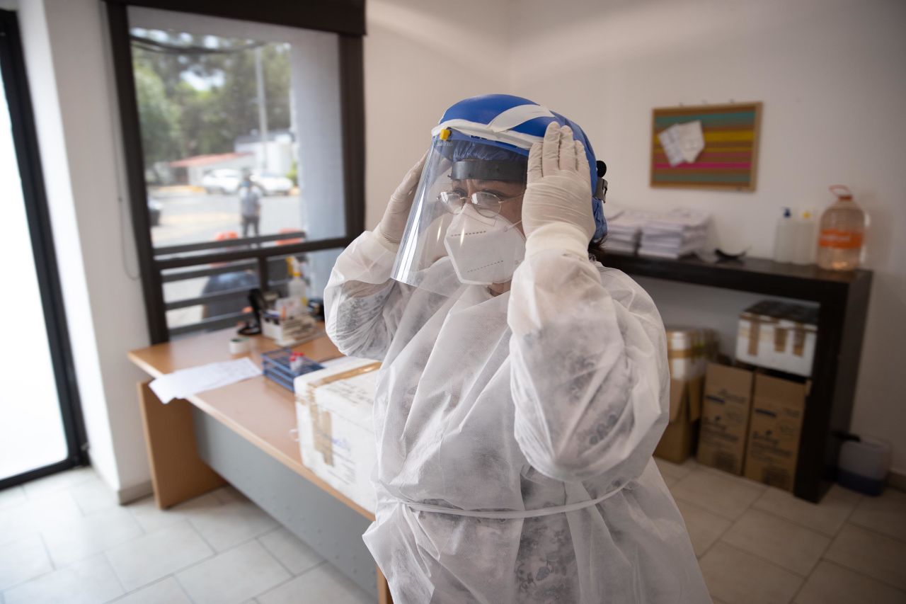 A doctor gestures inside a temporary sampling unit for COVID-19 in Mexico City, Mexico, on June 19.