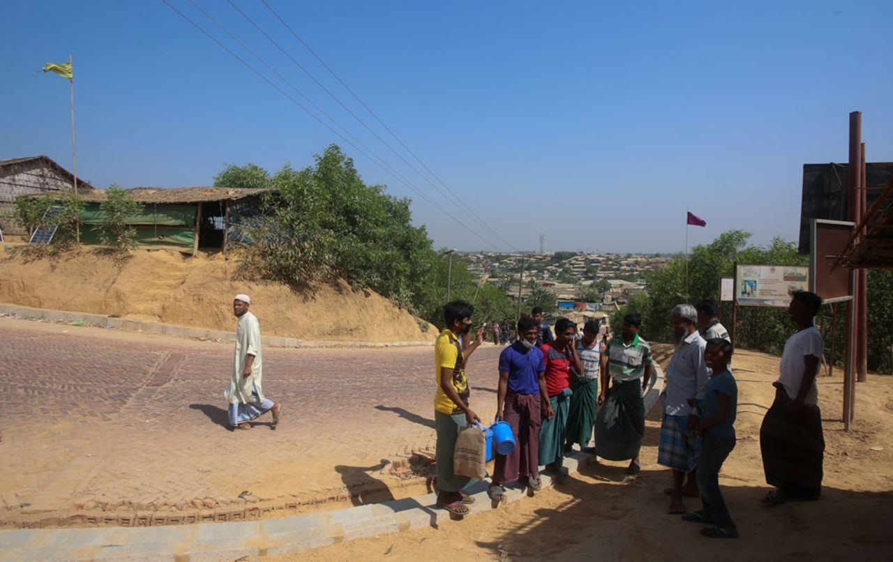 Rohingya refugees stand at the Kutupalong refugee camp, Cox’s Bazar, in Bangladesh, on April 1, 2020. 