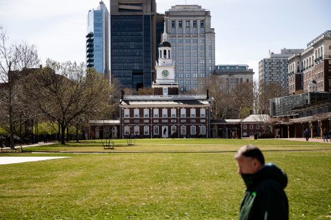 A pedestrian walks past Independence Hall in Philadelphia on Monday, March 16.