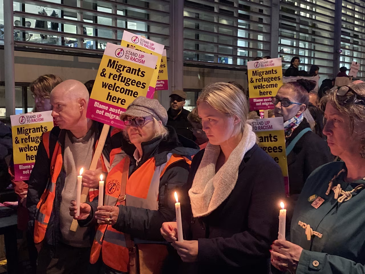 Mourners gather at the vigil outside the UK Home Office.