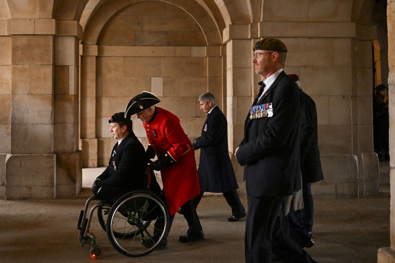 A veteran is assisted on the Horse Guards Parade during the Royal British Legion’s annual march in London on Sunday, November 10. It was Remembrance Sunday in the United Kingdom.