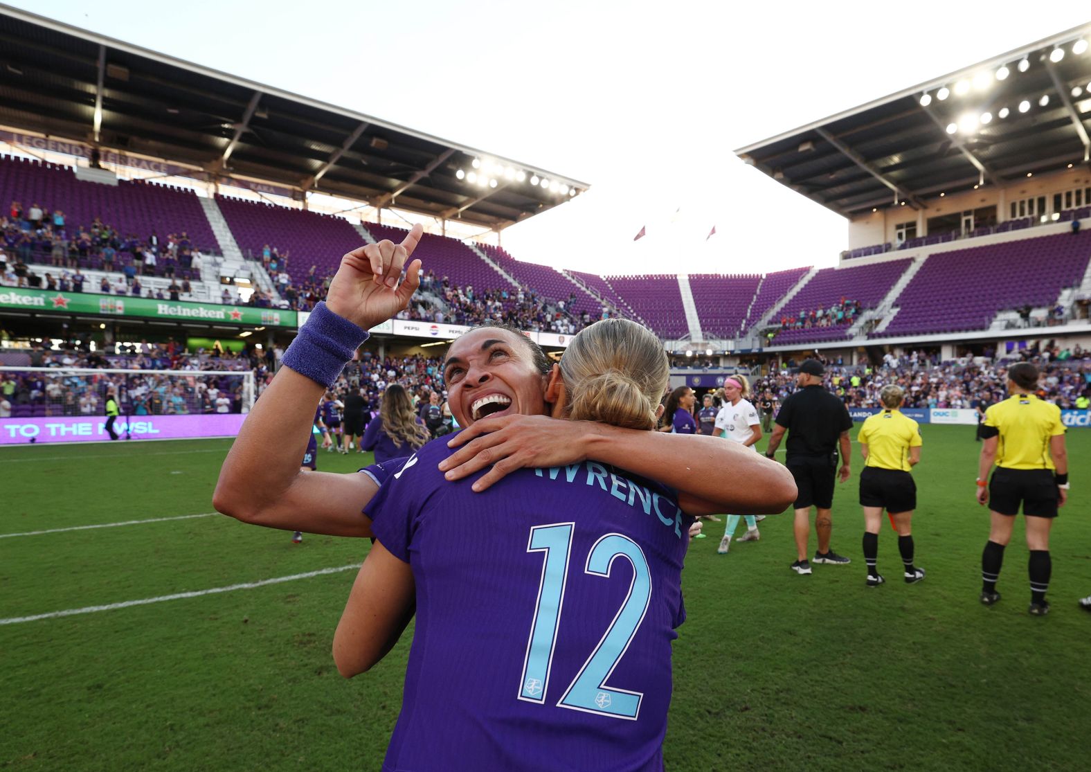 Orlando Pride forward Marta, left, celebrates with teammate Carrie Lawrence after they defeated the Kansas City Current on Sunday, November 17, to make the NWSL final.