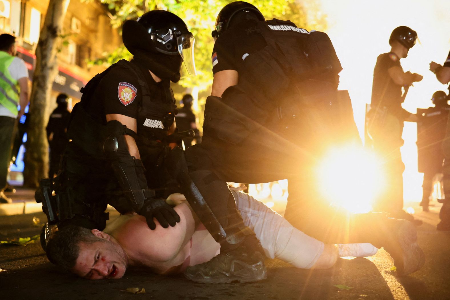 Law enforcement officers detain a demonstrator during an <a href="index.php?page=&url=https%3A%2F%2Fwww.cnn.com%2F2025%2F06%2F28%2Feurope%2Fpolice-clash-protesters-elections-serbia-latam-intl">anti-government protest</a> in Belgrade, Serbia, on Saturday, June 28. Thousands of protesters gathered to demand an early parliamentary election.