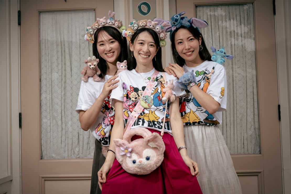 Mariko Otomo, 37, (C) poses with Nozomi Yasuda, 39 (L) and Yuka Izawa, 37, (R). This was the Japanese visitors' second day at the park.