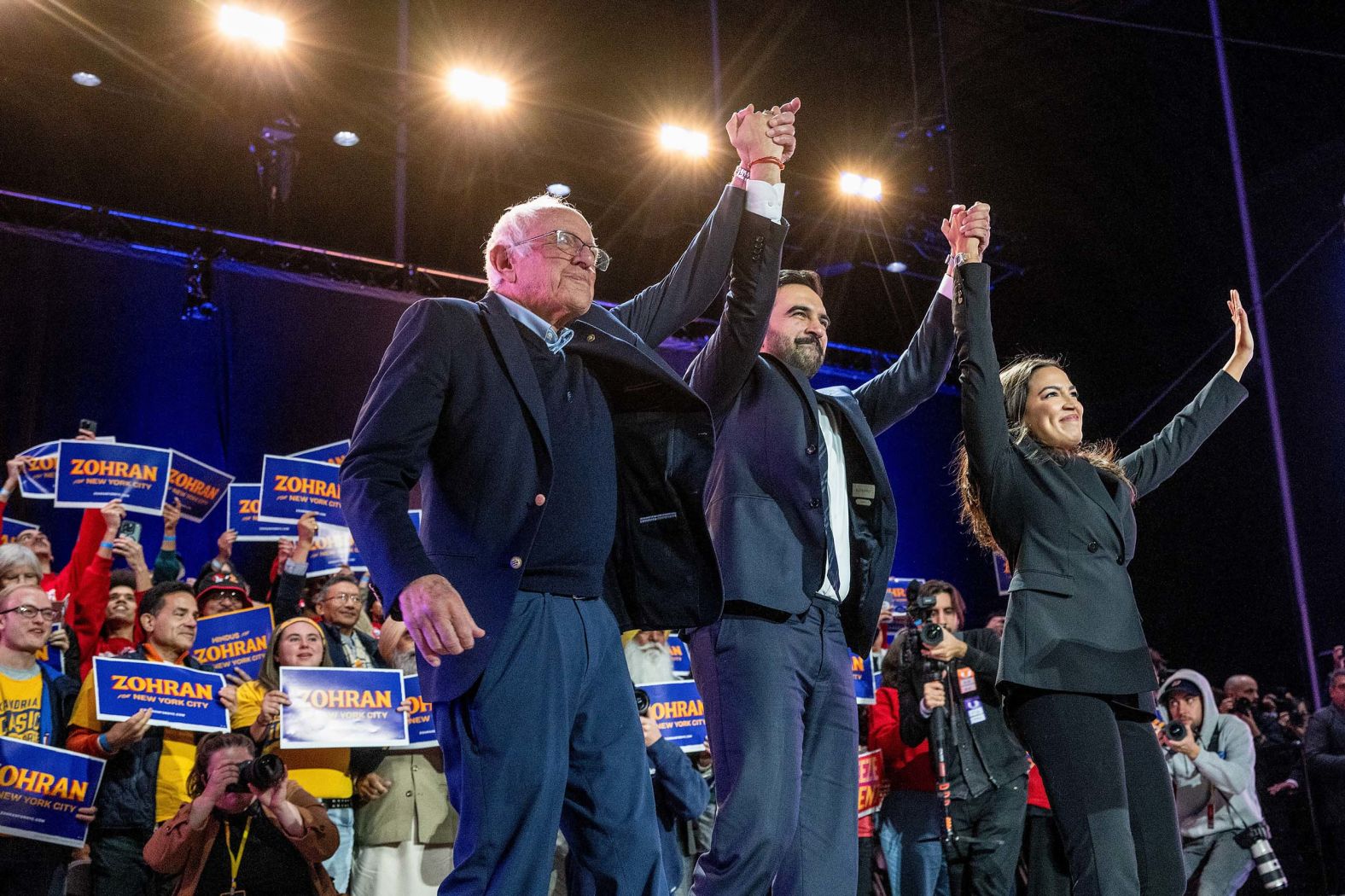 US Sen. Bernie Sanders, left, and US Rep. Alexandria Ocasio-Cortez attend a campaign event for New York City mayoral candidate Zohran Mamdani, center, on Sunday, October 26.
