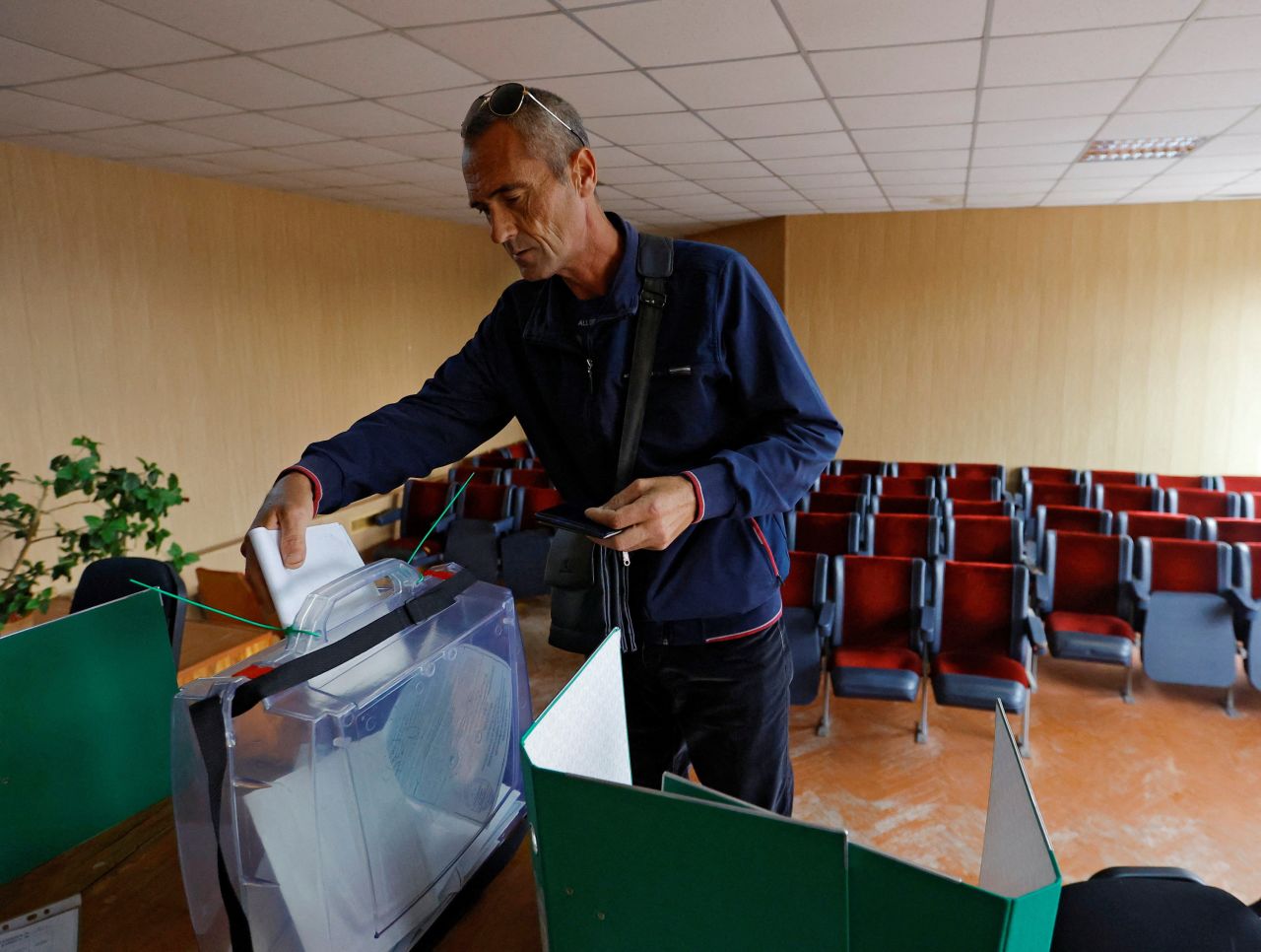 A man casts his ballot during a?referendum?on the secession of Zaporizhzhia region from Ukraine in the Russian-controlled city of Melitopol on September 26.