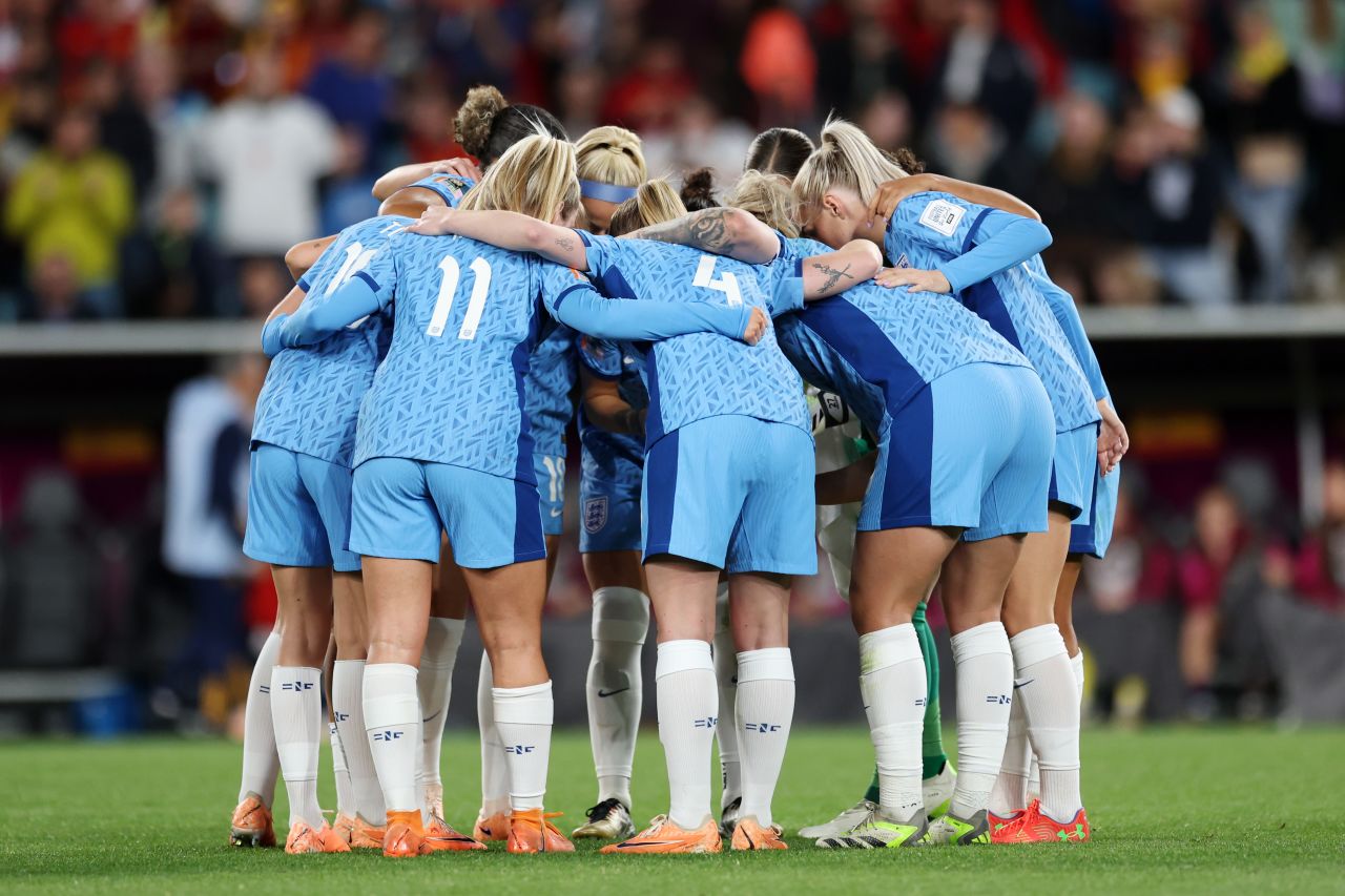 England players huddle before the start of the second half.