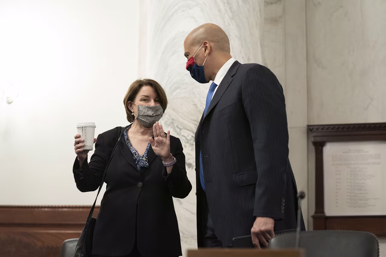 From left, Sen. Amy Klobuchar and Sen. Cory Booker talk before a Judiciary Committee meeting on Thursday, October 1. So far, all of the Senate Democrats on the Judiciary Committee have tested negative for coronavirus.