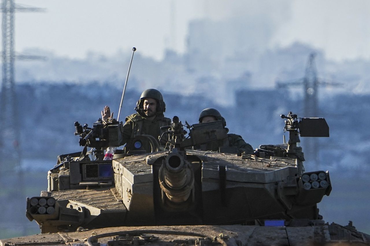 Israeli soldiers drive a tank near the border with Gaza on February 4.