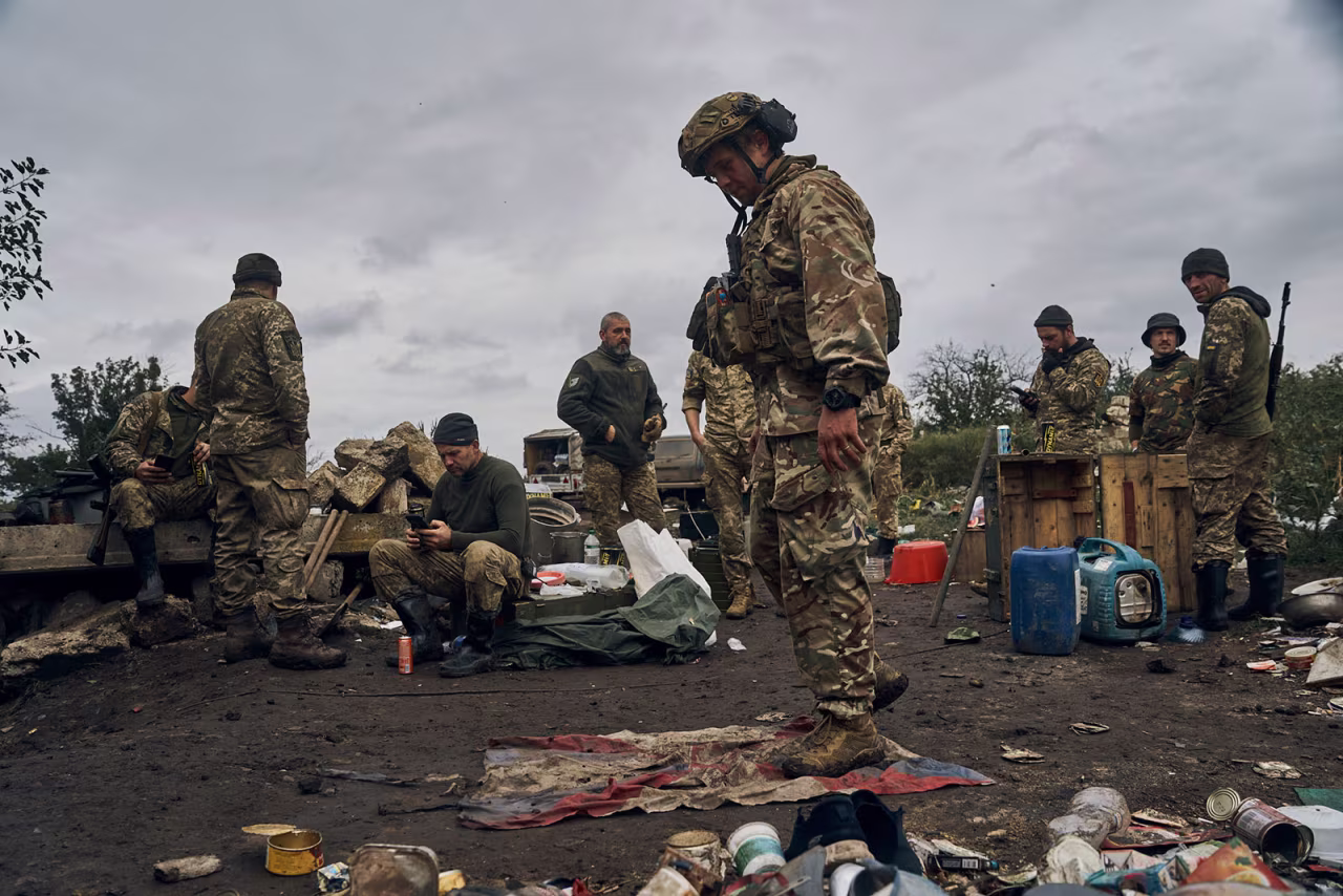 A Ukrainian soldier stands on a Russian flag in Izium, Kharkiv region, Ukraine, on September 13. 