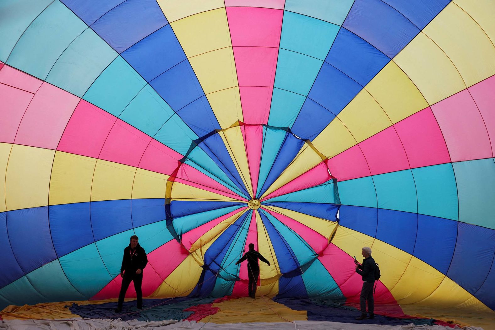 Crew members inflate a hot air balloon during the annual Bristol International Balloon Fiesta in Bristol, England, on Friday August 8.