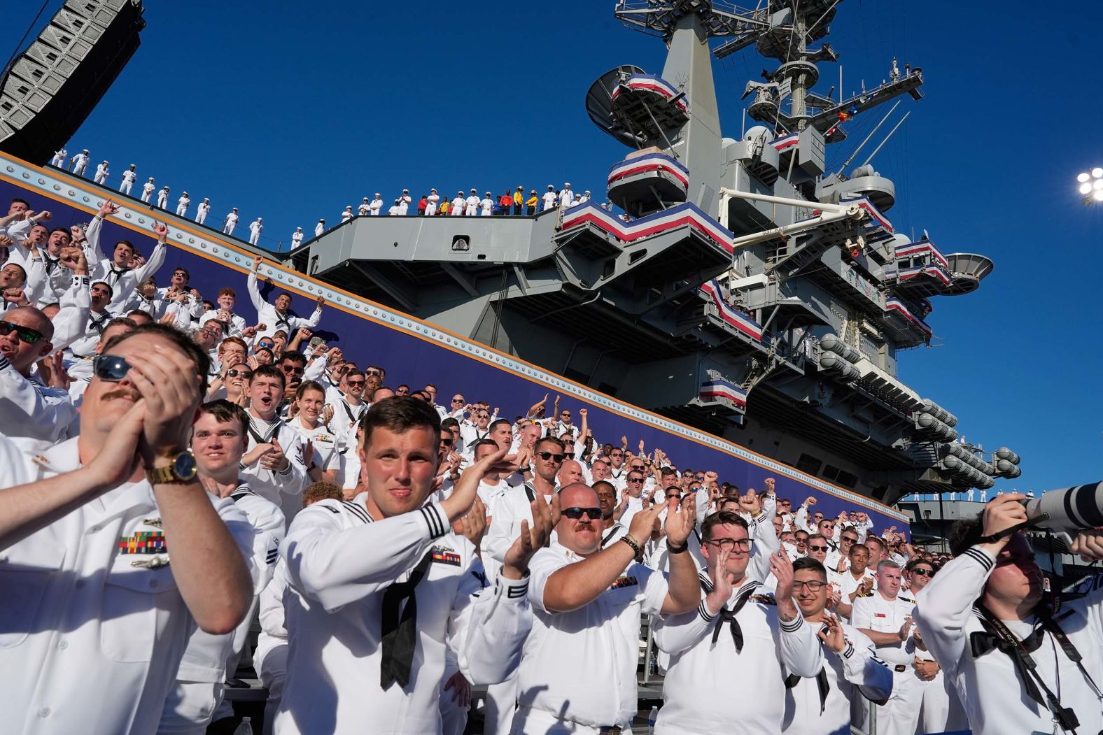 Sailors aboard the USS Harry S. Truman cheer as President Donald Trump speaks in Norfolk, Virginia, during a celebration for the 250th anniversary of the US Navy on Sunday, October 5.