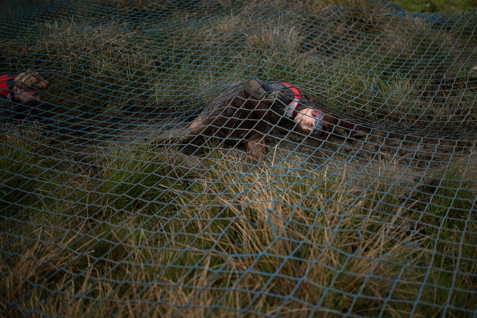 A competitor takes part in the Bog Commander obstacle race near Ashbourne, England, on Saturday, May 17.