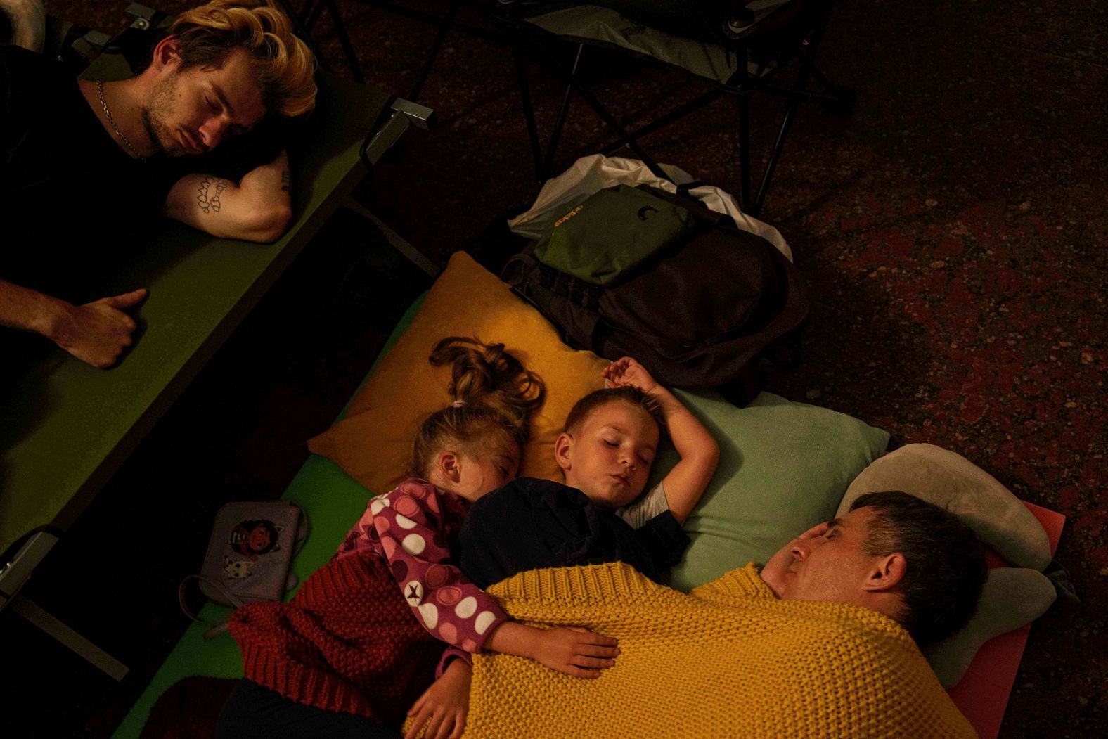 A family sleeps on the platform of a metro station as they take cover from a Russian attack in Kyiv, Ukraine, on Thursday, July 10. <a href="index.php?page=&url=https%3A%2F%2Fwww.cnn.com%2F2025%2F07%2F09%2Feurope%2Frussia-air-assault-ukraine-kyiv-intl-hnk">Hundreds of Russian drones</a> flying from all directions attacked Kyiv overnight.