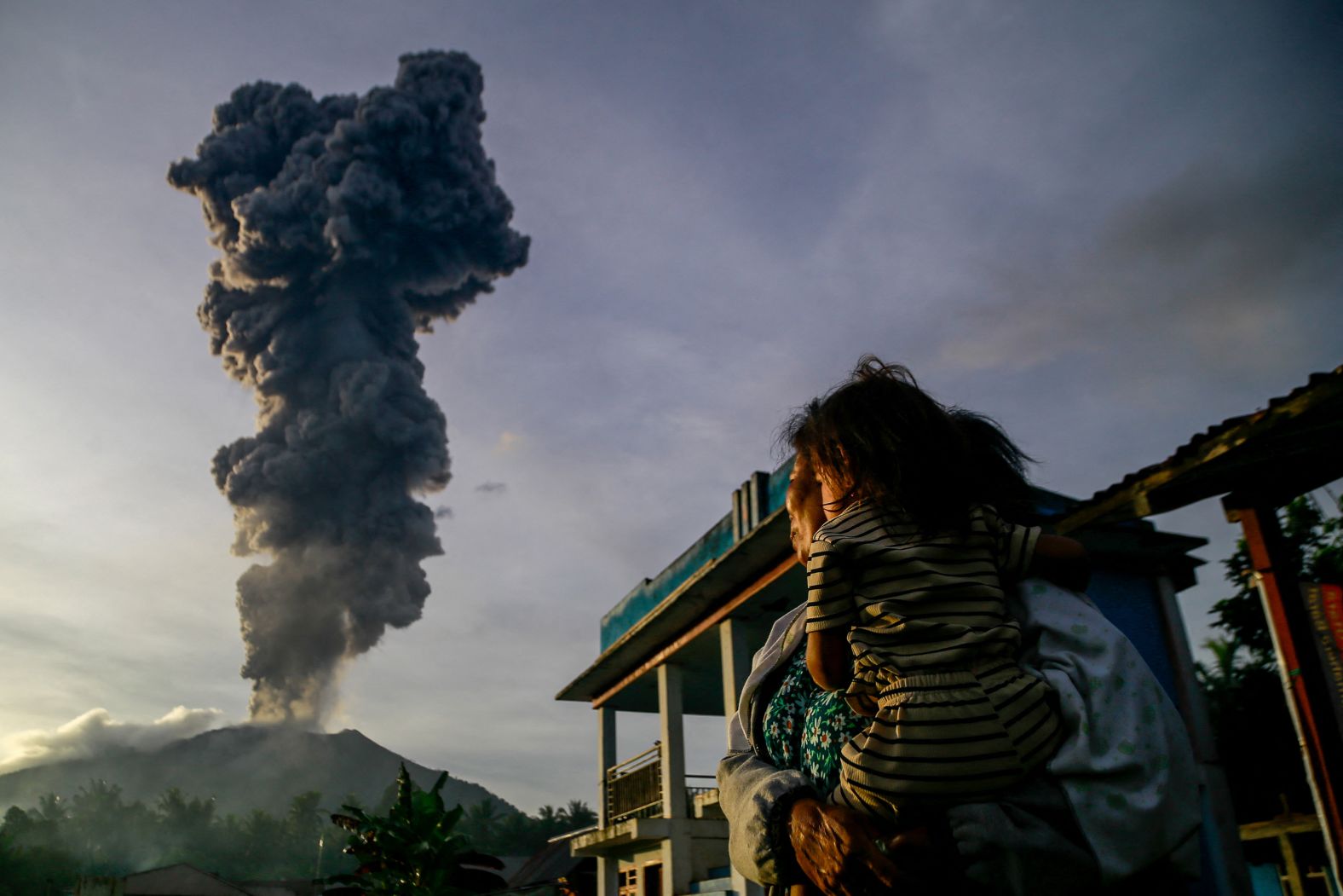 Volcanic ash rises into the air during the eruption of Mount Ibu in Indonesia on Wednesday, January 15.