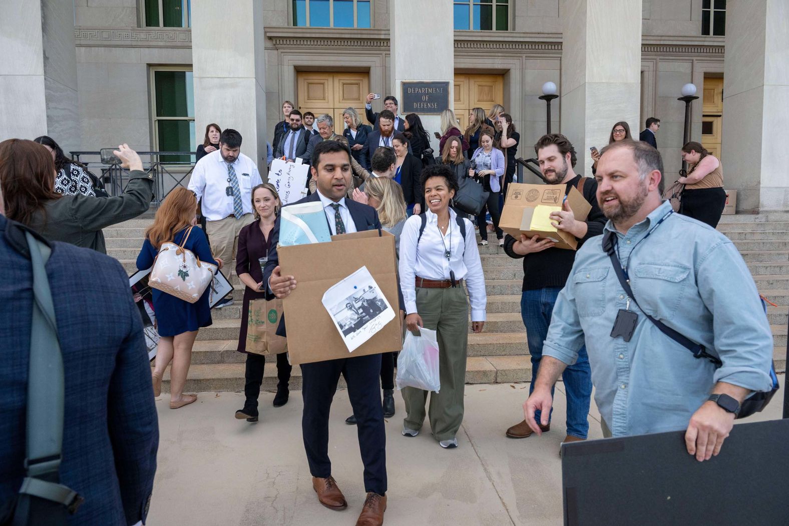 Members of the Pentagon press corps carry their belongings out of the Pentagon after turning in their press credentials on Wednesday, October 15. The Pentagon told beat reporters to sign <a href="index.php?page=&url=https%3A%2F%2Fwww.cnn.com%2F2025%2F10%2F13%2Fmedia%2Fpentagon-hegseth-press-restrictions-newsmax-fox-news">restrictive new rules</a> by Tuesday or surrender their press passes by Wednesday. Virtually every news outlet has rejected the ultimatum and said they will not sign.
