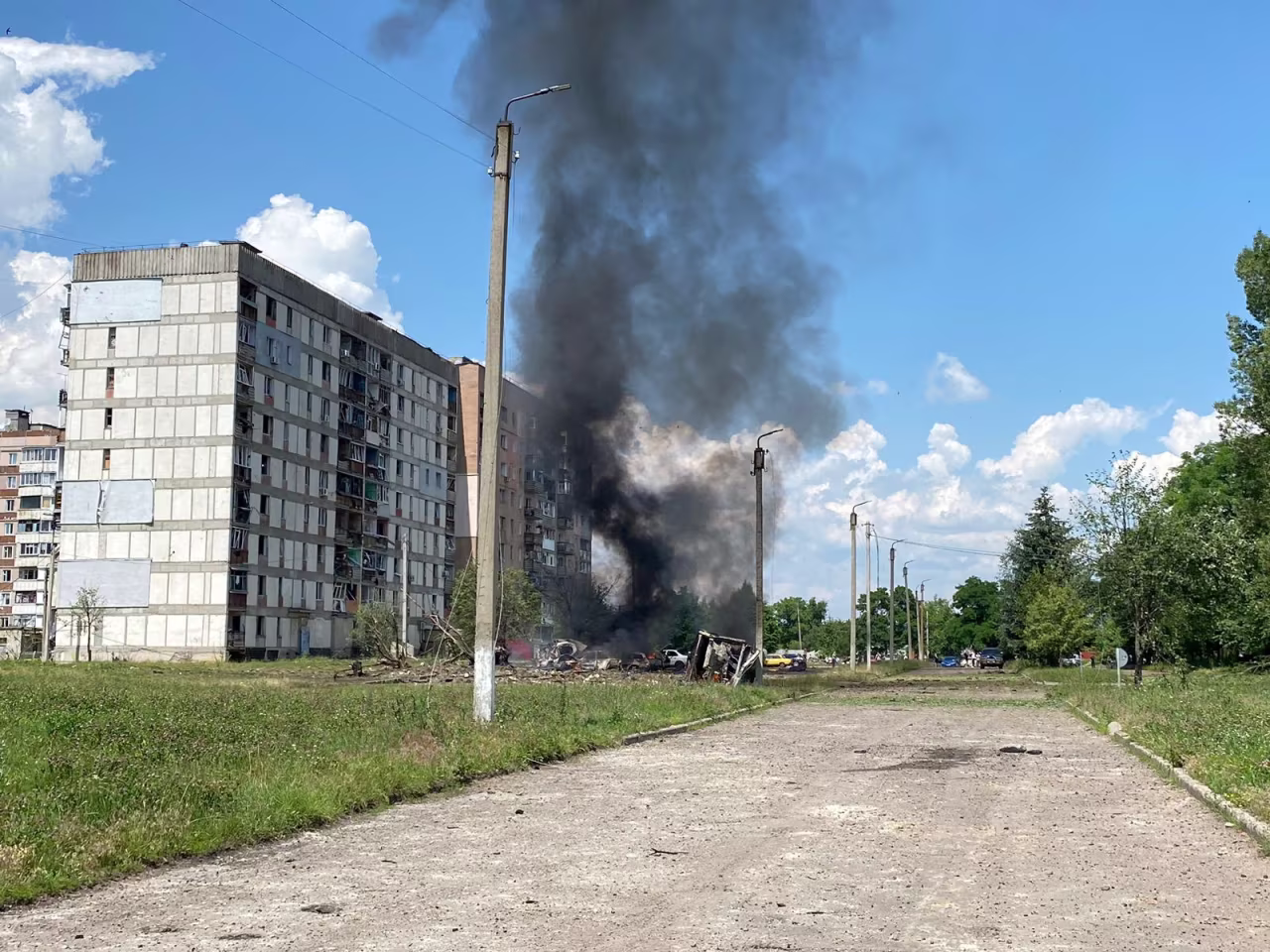 Cars burn at a site of a Russian military strike in the town of Pervomaiskyi in Kharkiv region, Ukraine, on July 4.