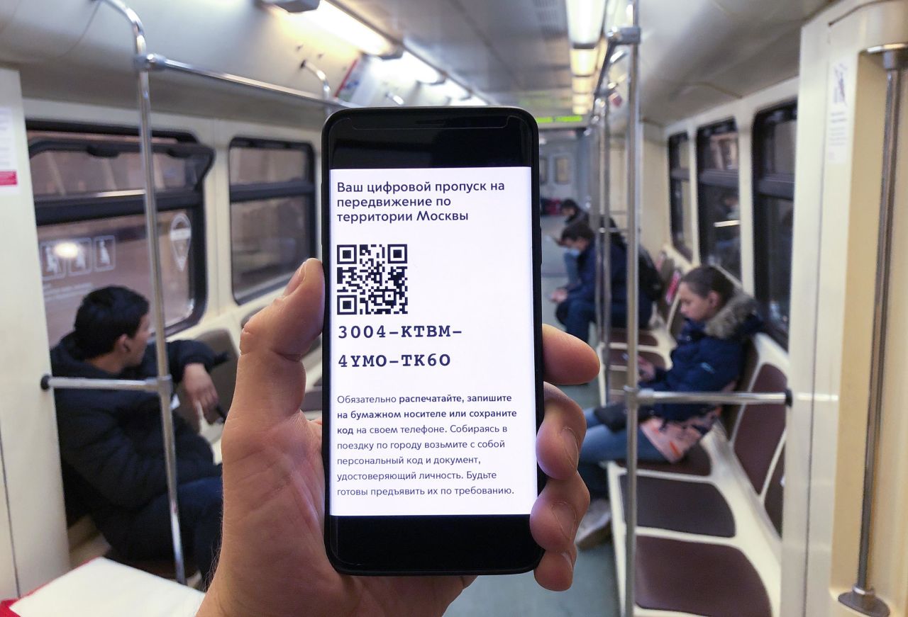 A Moscow metro passenger displays an electronic pass Tuesday with a QR code on a phone.