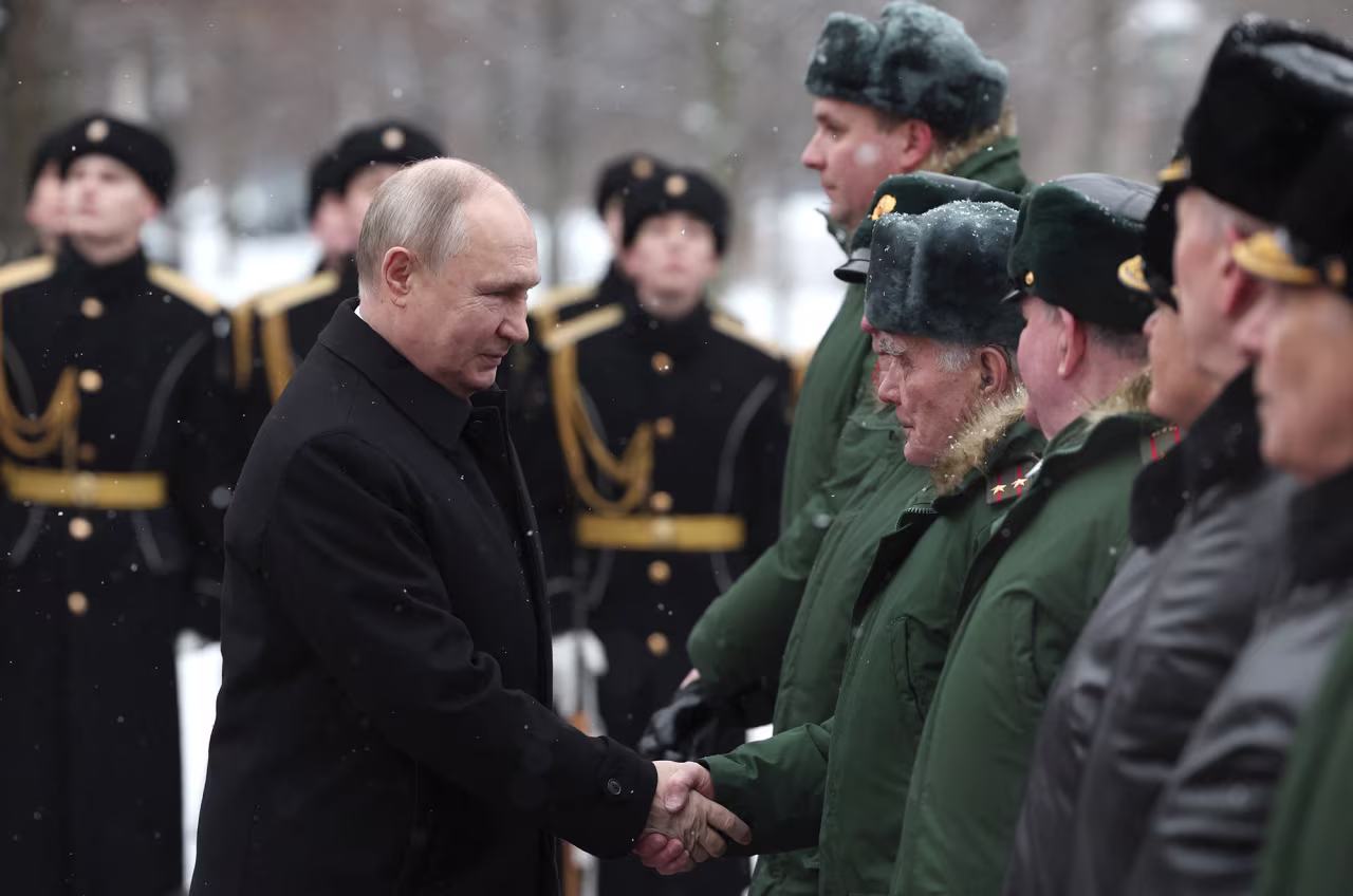 Russia's President Vladimir Putin attends a wreath-laying ceremony at the Tomb of the Unknown Soldier by the Kremlin Wall to mark the Defender of the Fatherland Day in Moscow, Russia, on February 23.