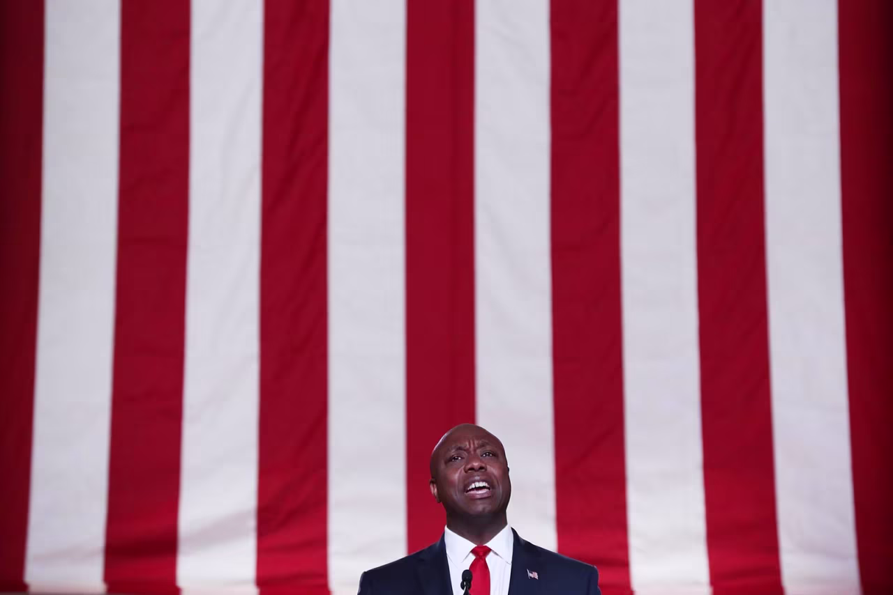 Sen. Tim Scott of South Carolina stands on stage in an empty Mellon Auditorium while addressing the Republican National Convention on Monday in Washington.