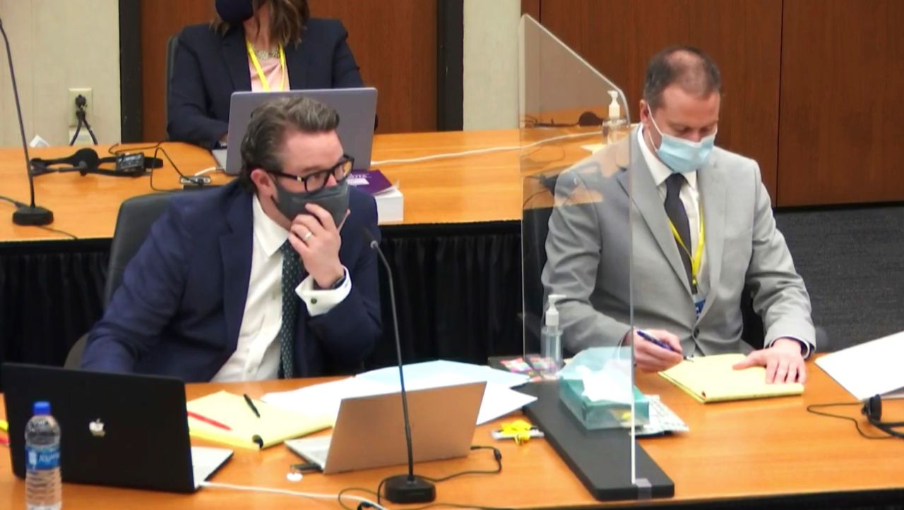 Defense attorney Eric Nelson, left, and defendant, former Minneapolis police Officer Derek Chauvin listen to testimony on April 1 at the Hennepin County Courthouse in Minneapolis. 