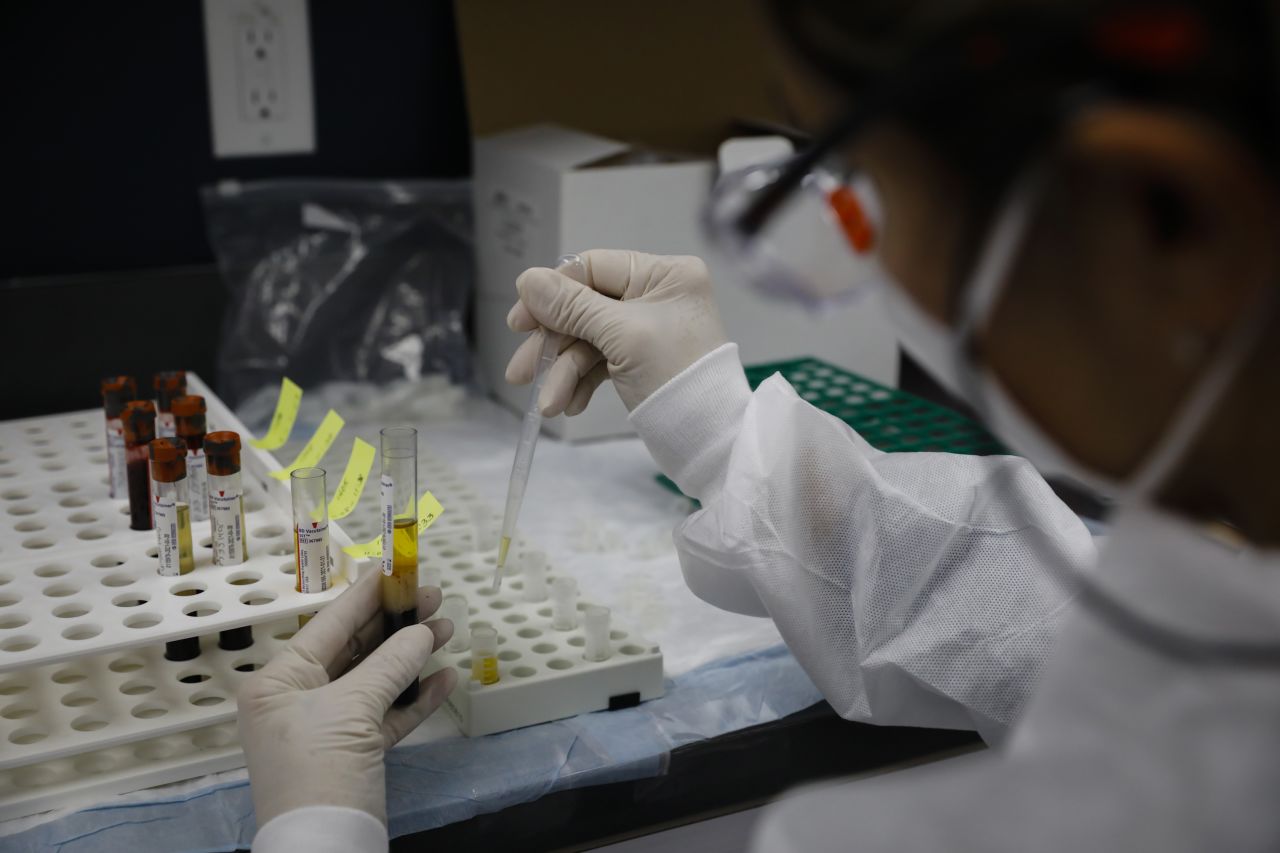 A health worker works in a lab during clinical trials for a Covid-19 vaccine at Research Centers of America in Hollywood, Florida, on September 9.