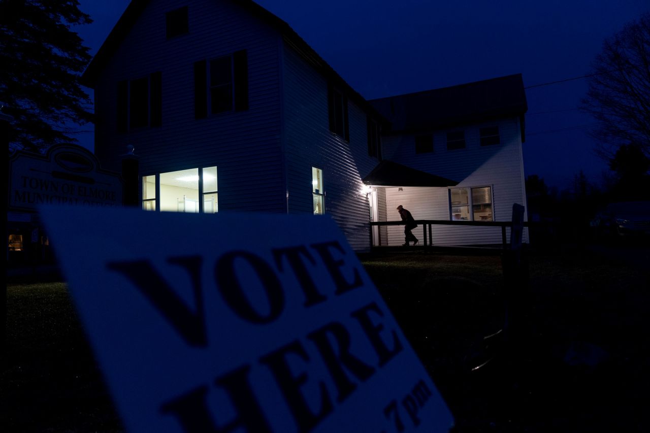 A voter enters a polling site for the presidential primary election at the town office on Tuesday evening in Elmore, Vermont.