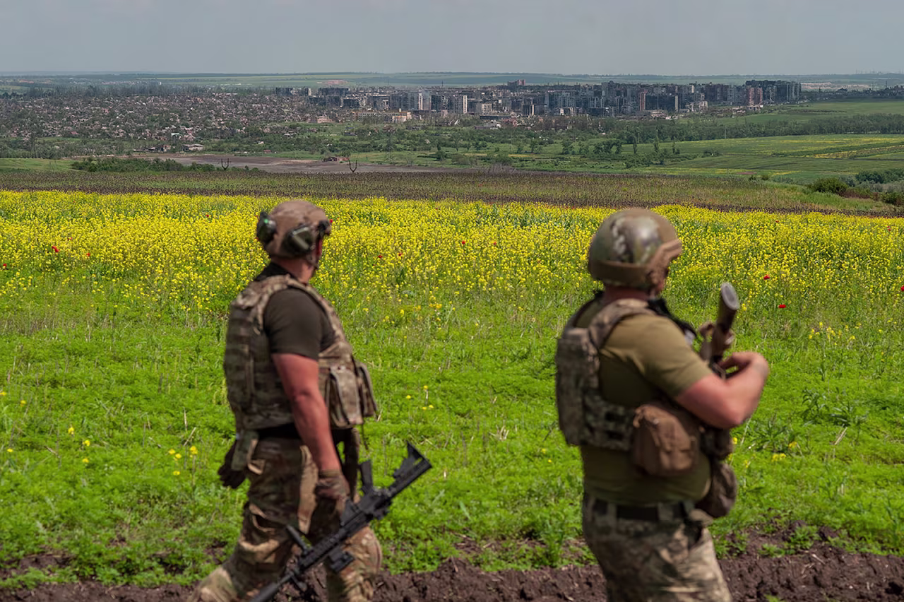 Ukrainian soldiers stand in their positions near Bakhmut, Ukraine, on Monday, June 5.
