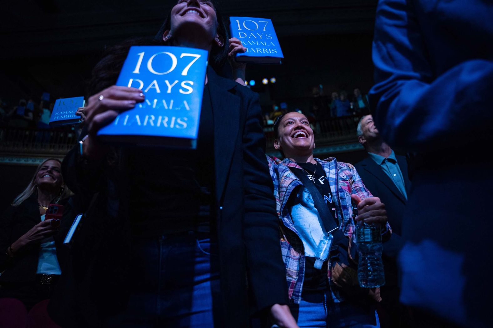 People hold copies of “107 Days,” Kamala Harris’ campaign memoir, as the former vice president and US presidential candidate <a href="index.php?page=&url=https%3A%2F%2Fwww.cnn.com%2F2025%2F09%2F22%2Fpolitics%2Fkamala-harris-interview-new-book-takeaways">starts her book tour</a> in New York on Wednesday, September 24.