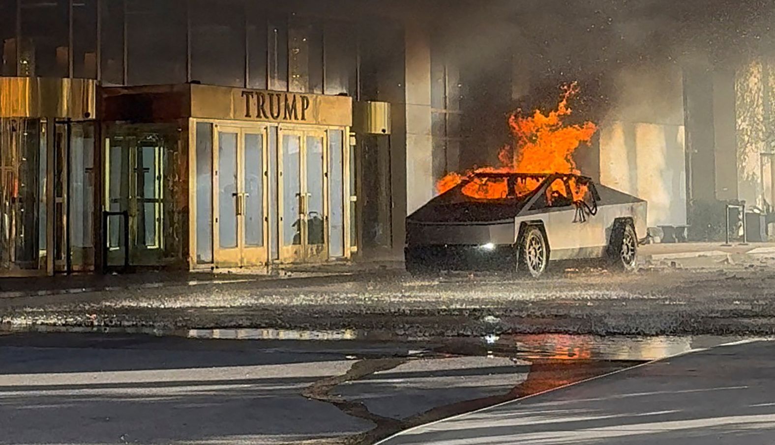 In this image, taken from a social media video, a Tesla Cybertruck is on fire after <a href="index.php?page=&url=https%3A%2F%2Fwww.cnn.com%2F2025%2F01%2F02%2Fus%2Ftesla-cybertruck-trump-hotel-wwk-hnk%2Findex.html">exploding outside the Trump International Hotel in Las Vegas</a> on Wednesday, January 1. Las Vegas Sheriff Kevin McMahill said in a news conference Thursday that the driver shot himself in the head prior to the blast that injured seven people outside the hotel.