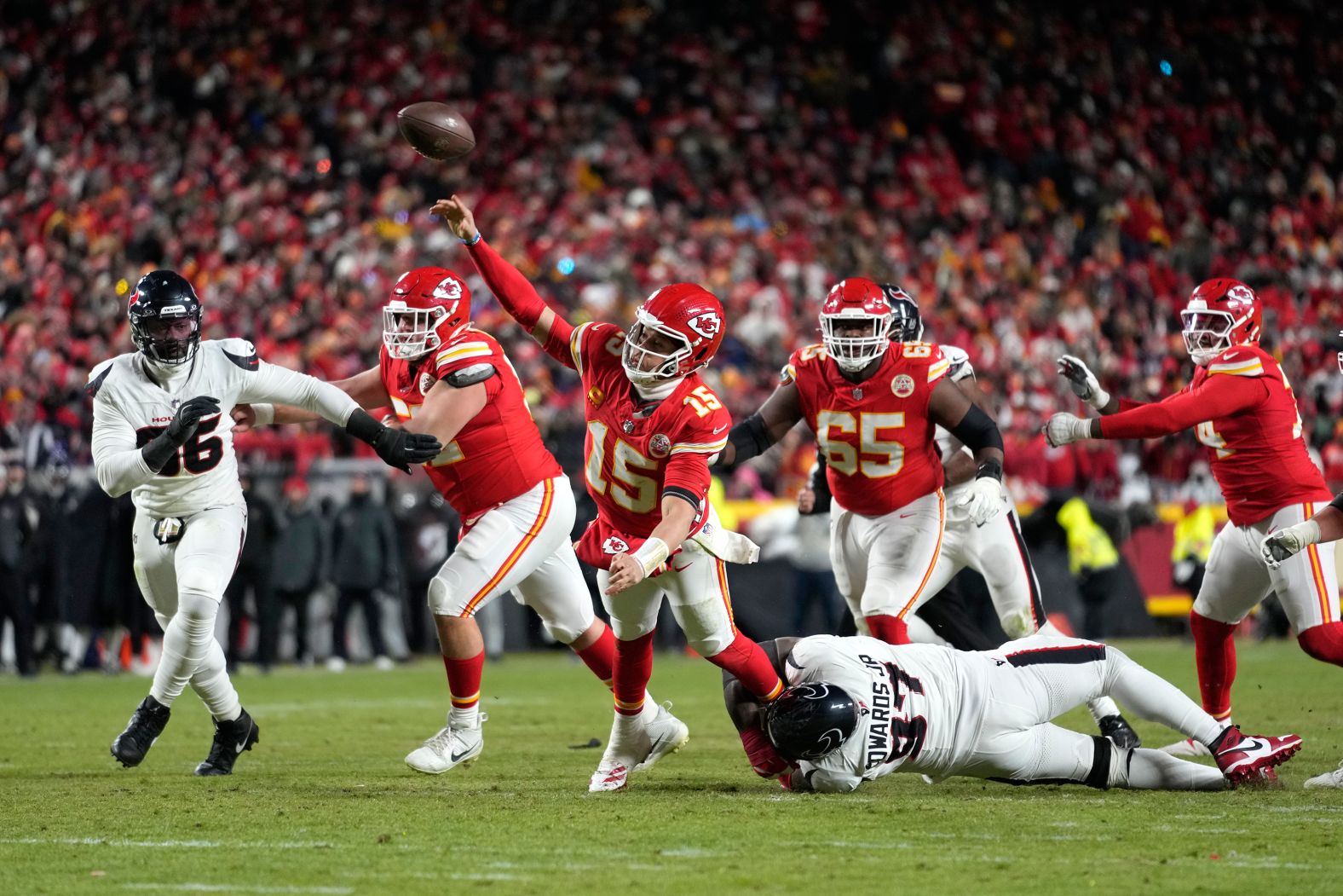 Kansas City Chiefs quarterback Patrick Mahomes throws a touchdown pass while falling down during <a href="index.php?page=&url=https%3A%2F%2Fwww.cnn.com%2F2025%2F01%2F19%2Fsport%2Fnfl-playoffs-washington-kansas-city-win%2Findex.html">the Chiefs’ playoff victory over the Houston Texans</a> on Saturday, January 18. The Chiefs are looking to win the third straight Super Bowl, a feat that has never been accomplished.