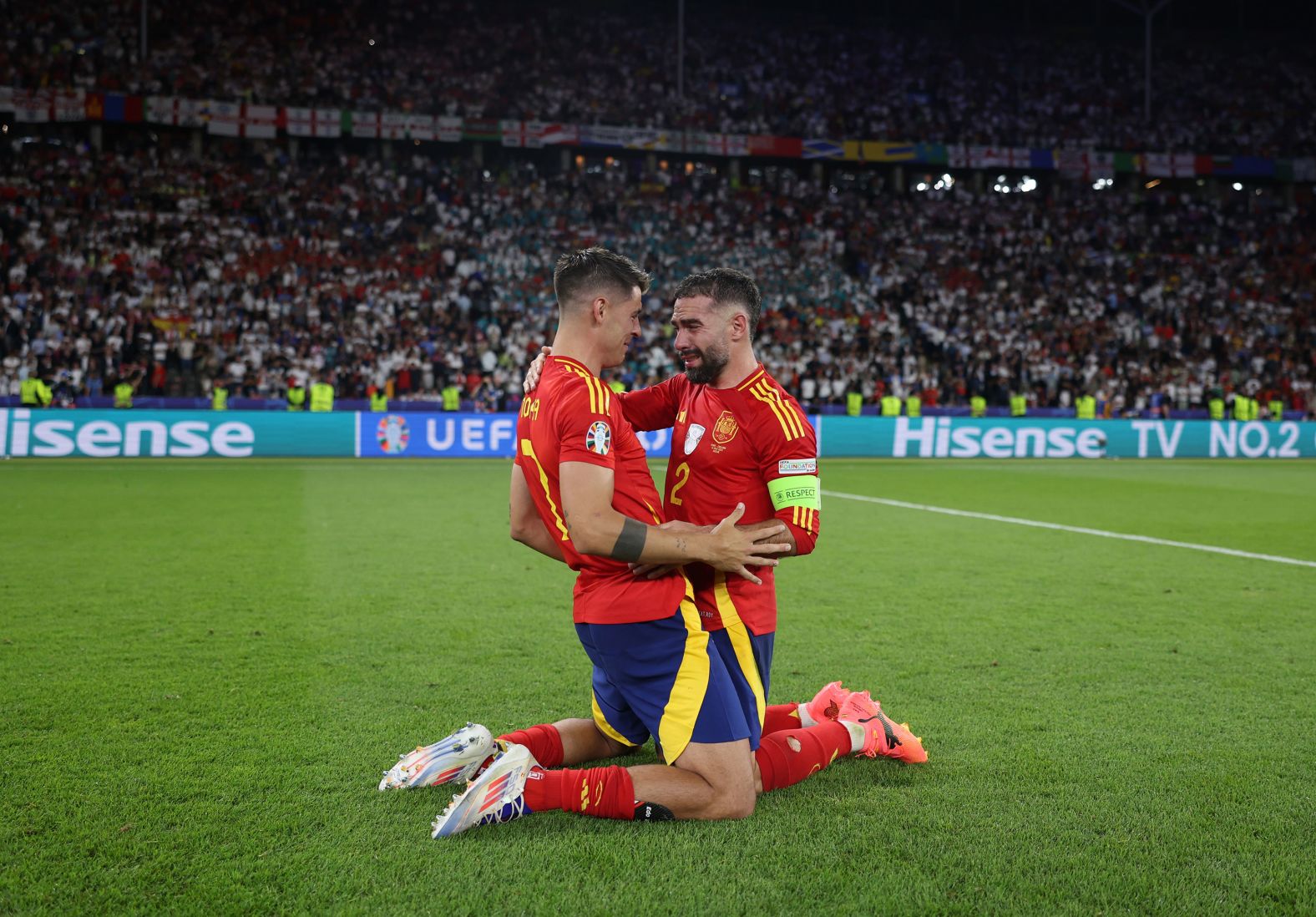 Álvaro Morata, left, and Dani Carvajal celebrate after <a href="index.php?page=&url=https%3A%2F%2Fwww.cnn.com%2F2024%2F07%2F14%2Fsport%2Fspain-england-euro-2024-final-spt-intl%2Findex.html">Spain defeated England 2-1</a> to win its record-breaking fourth European Championship on Sunday, July 14.