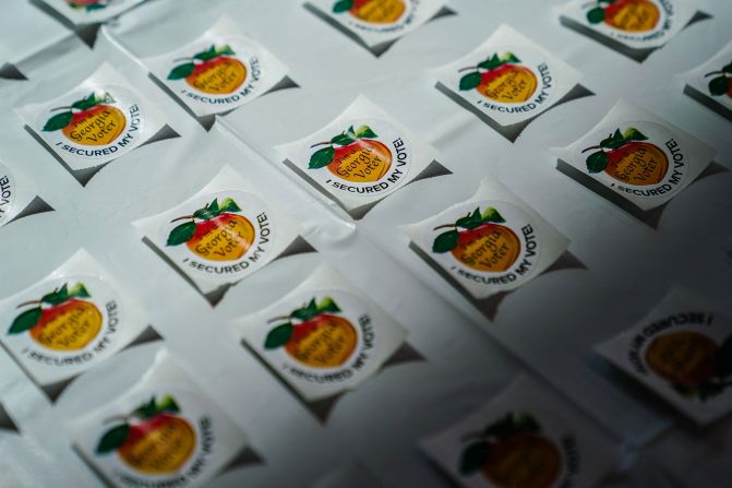 Stickers are arranged on a table at a polling location in College Park, Georgia, on Tuesday.